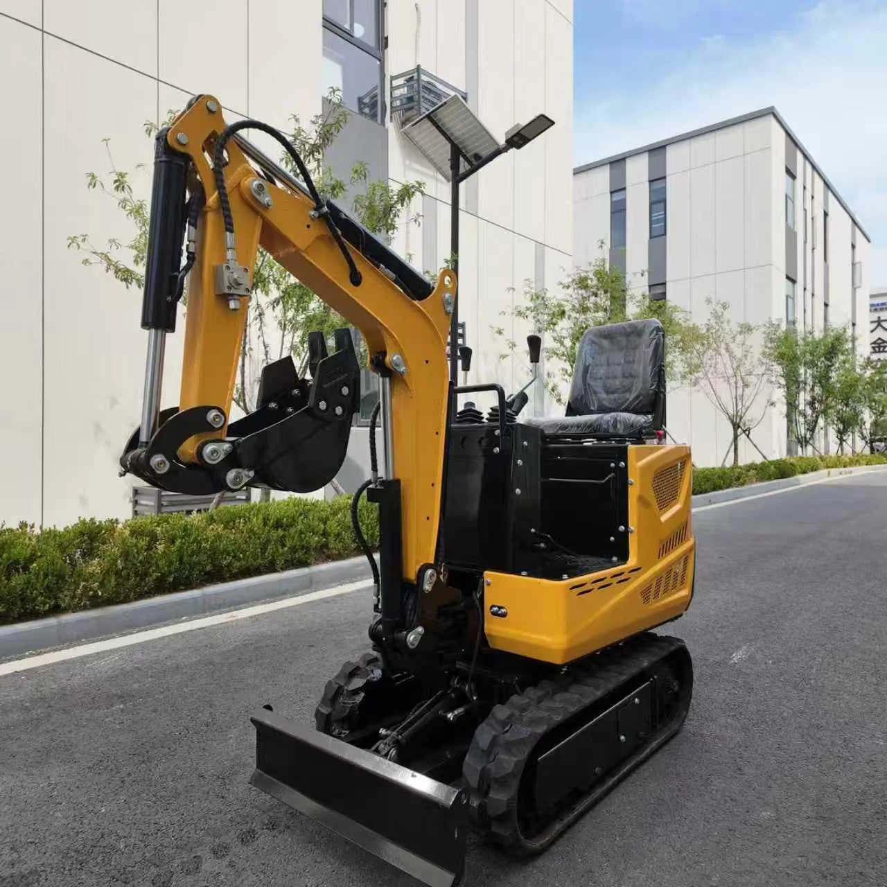 Compact tracked excavator with boom, bucket and dozer blade