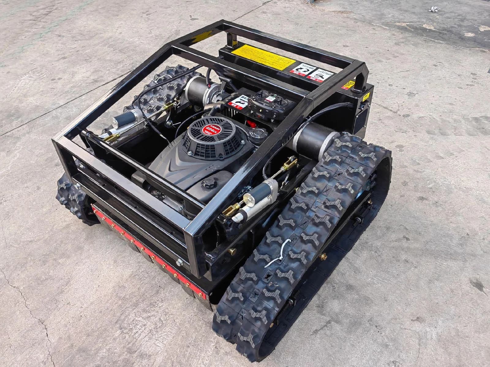 Remote-control mower with a tracked chassis
