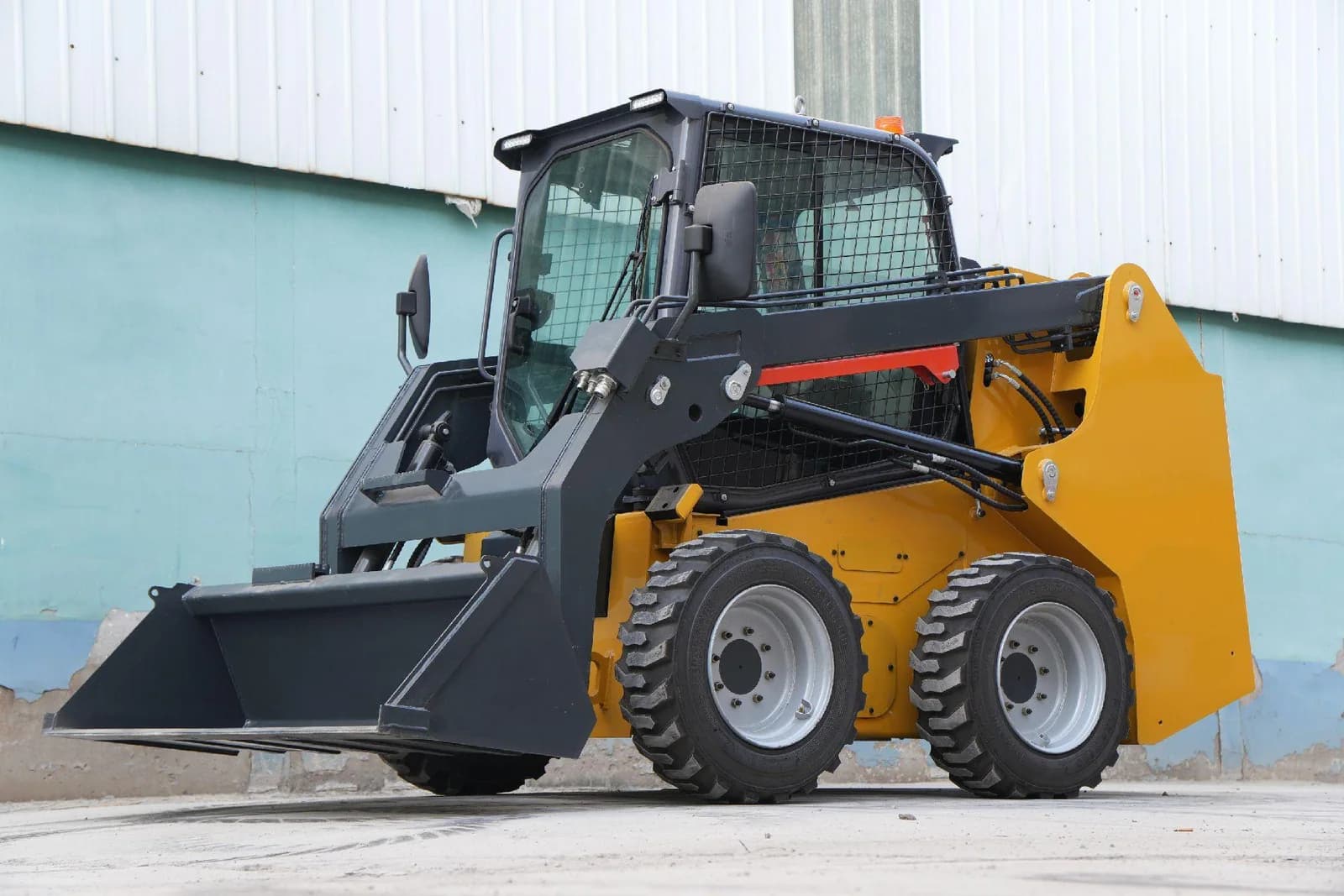 Wheeled skid steer loader with cab, lift arms and bucket